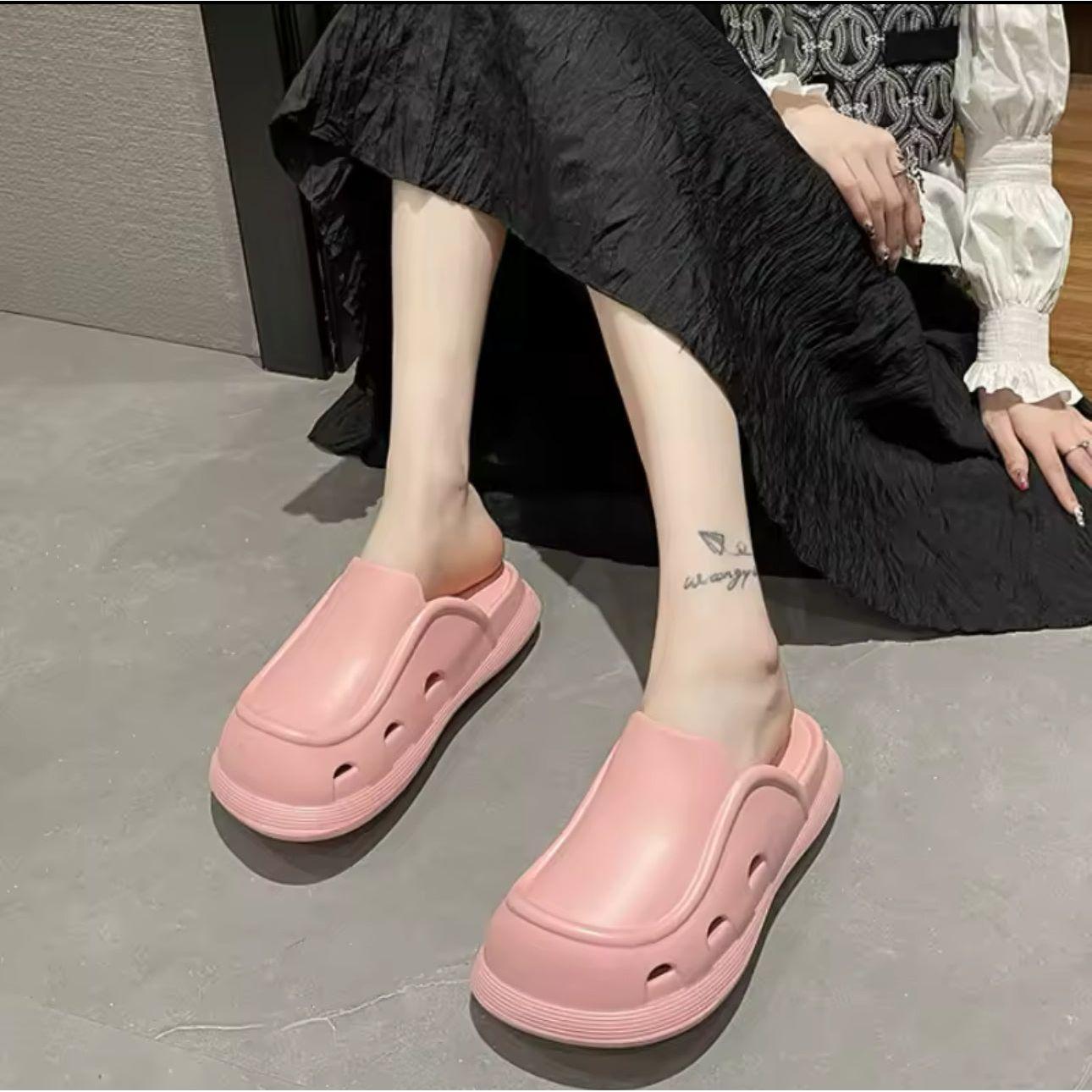 Thick bottom closed toe porous shoes.