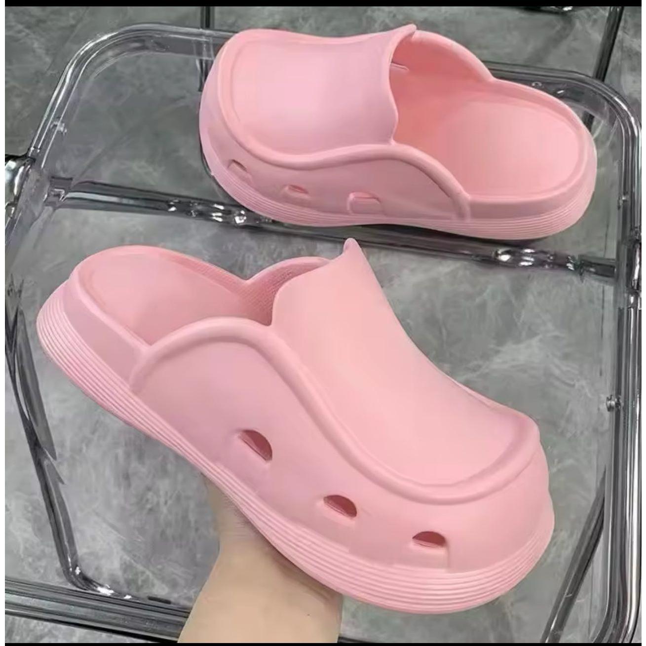 Thick bottom closed toe porous shoes.