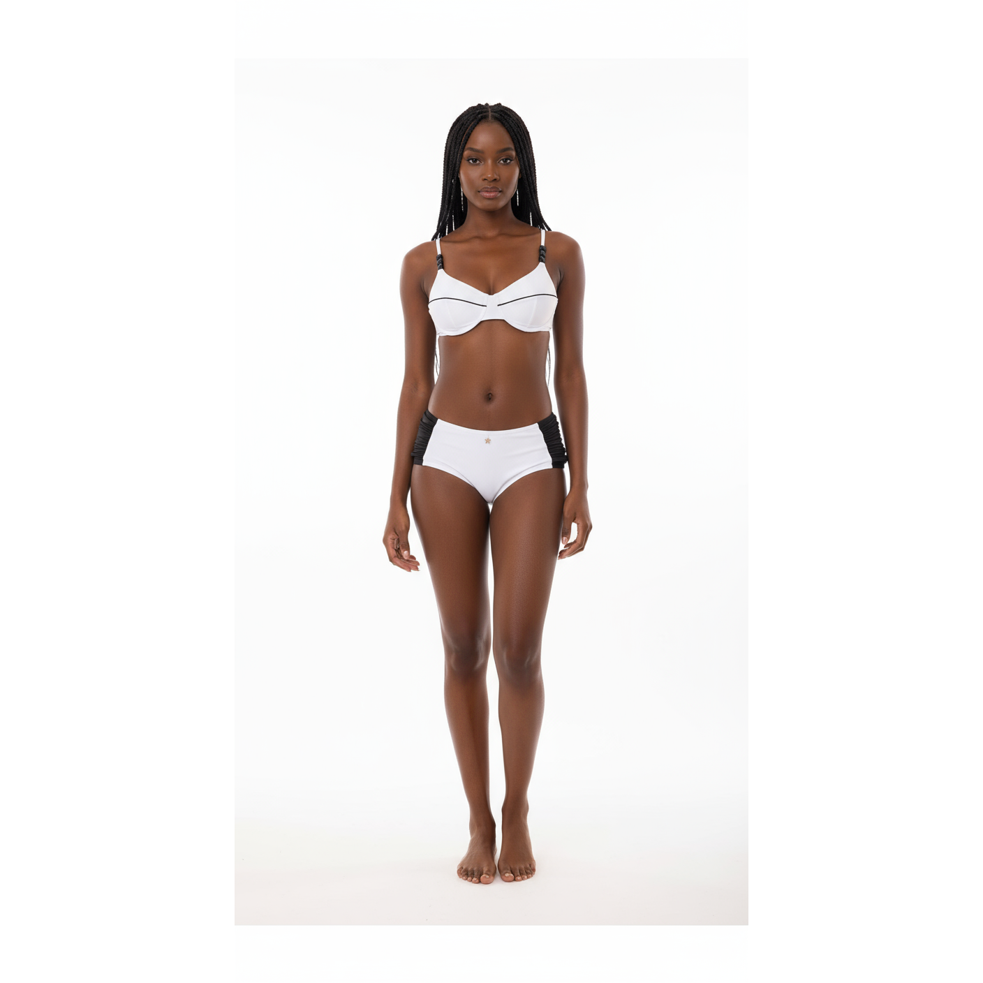 White bikini set on a mannequin against a white background