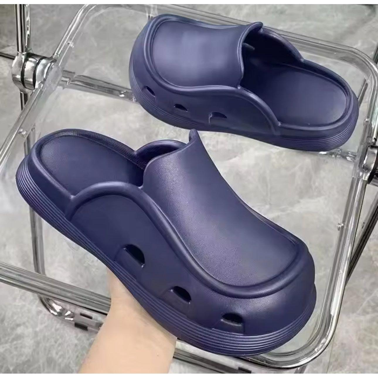 Thick bottom closed toe porous shoes.