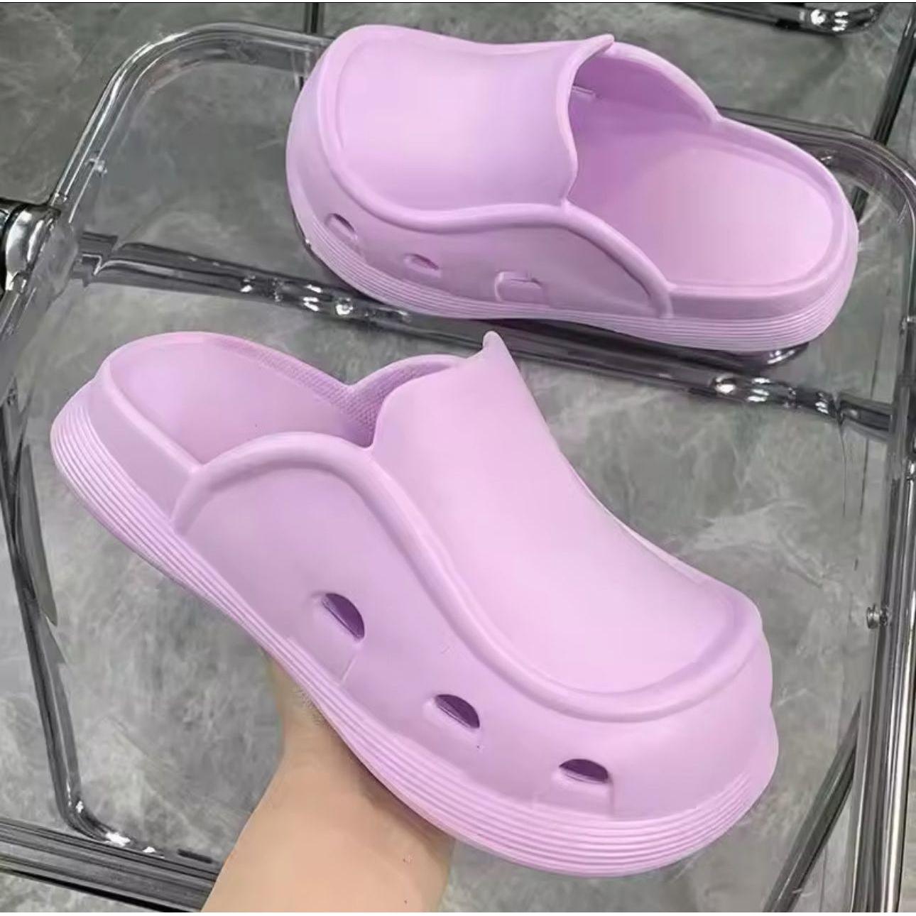 Thick bottom closed toe porous shoes.