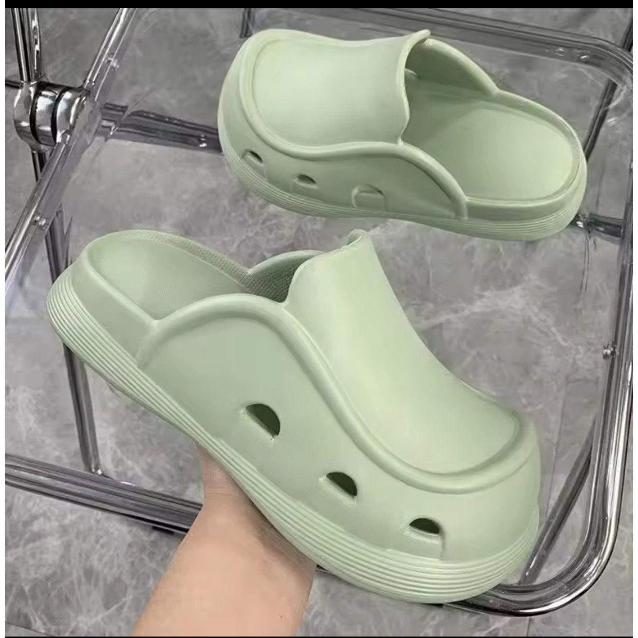 Thick bottom closed toe porous shoes.