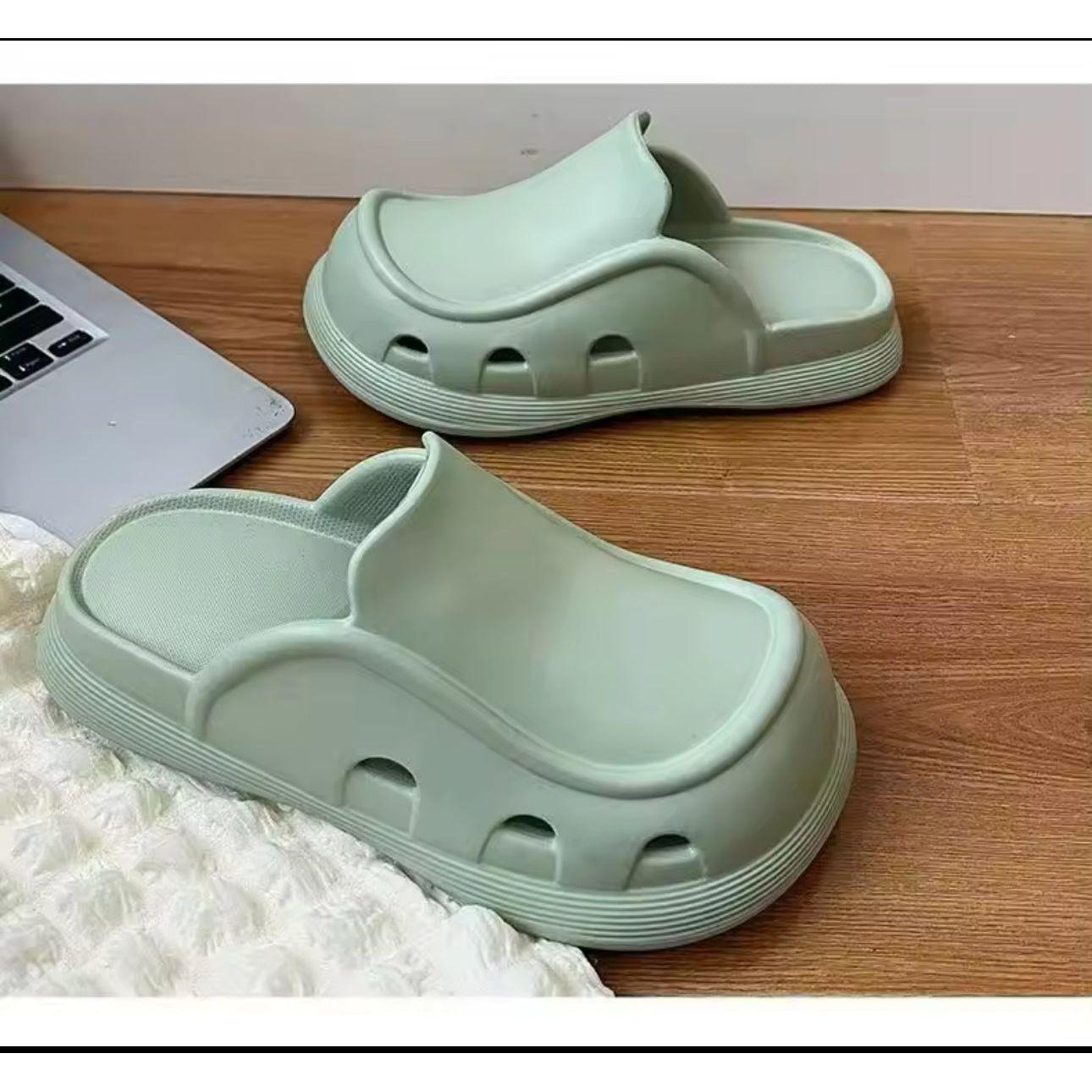 Thick bottom closed toe porous shoes.