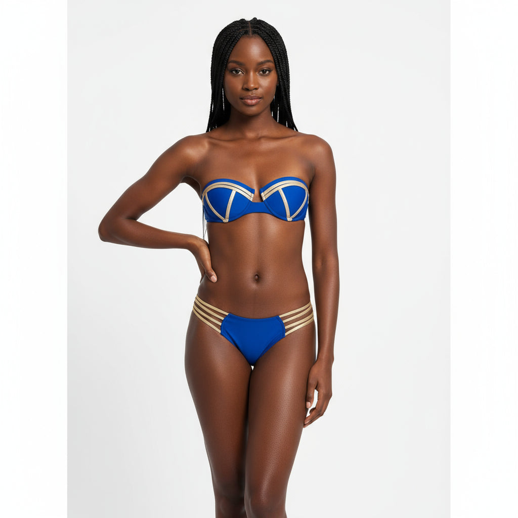 Woman wearing a blue and gold bikini on a white background