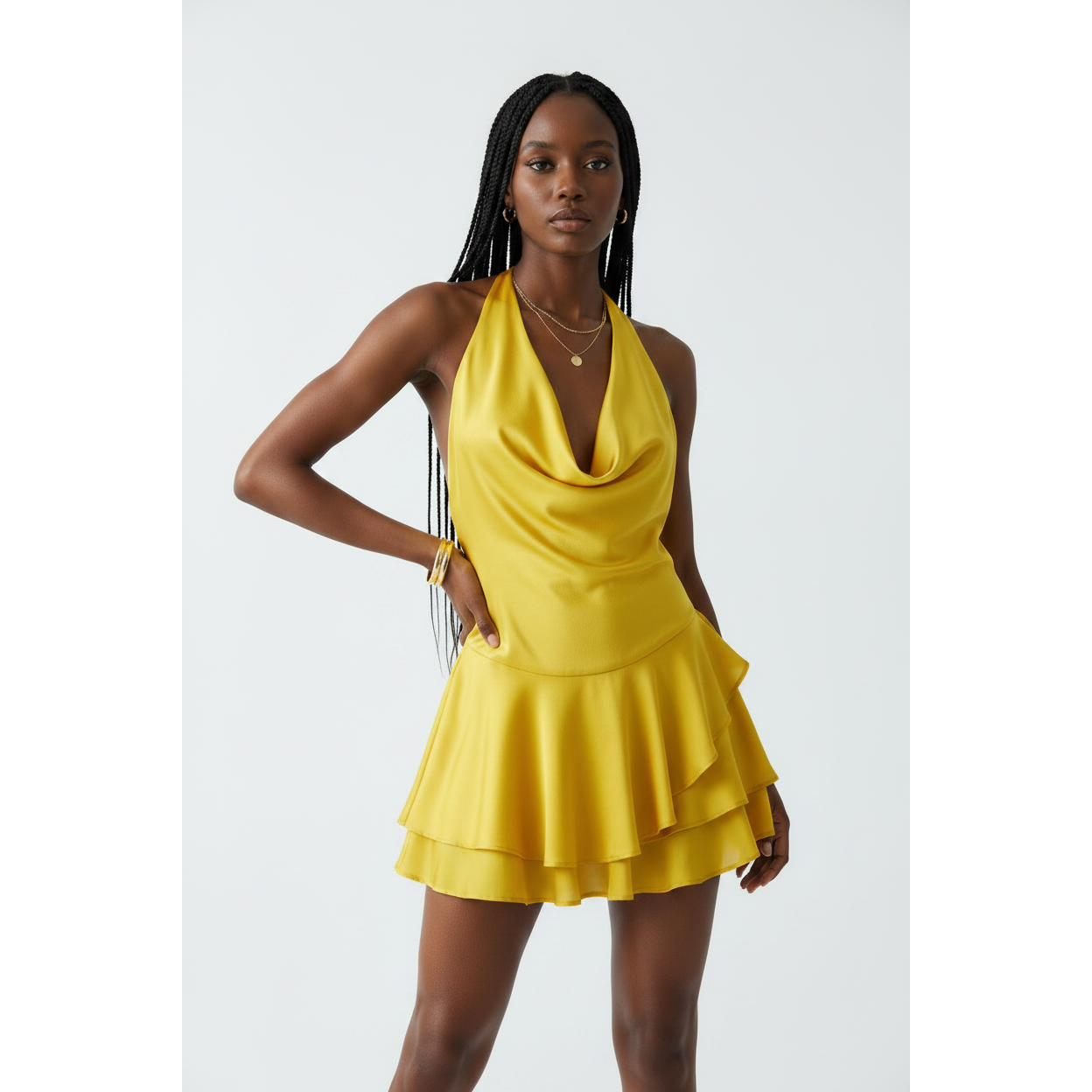Open-back silhouette with lower back accent strap