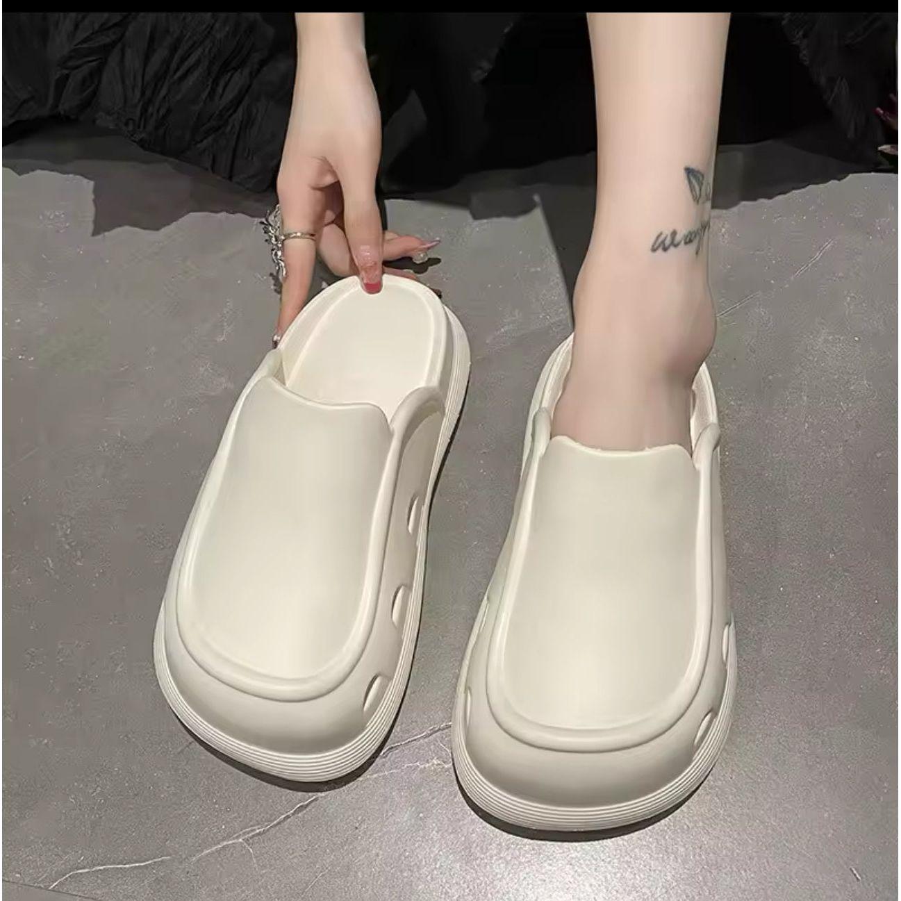 Thick bottom closed toe porous shoes.