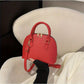 Mini Crocodile Embossed Dome Handbag.
