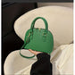 Mini Crocodile Embossed Dome Handbag.