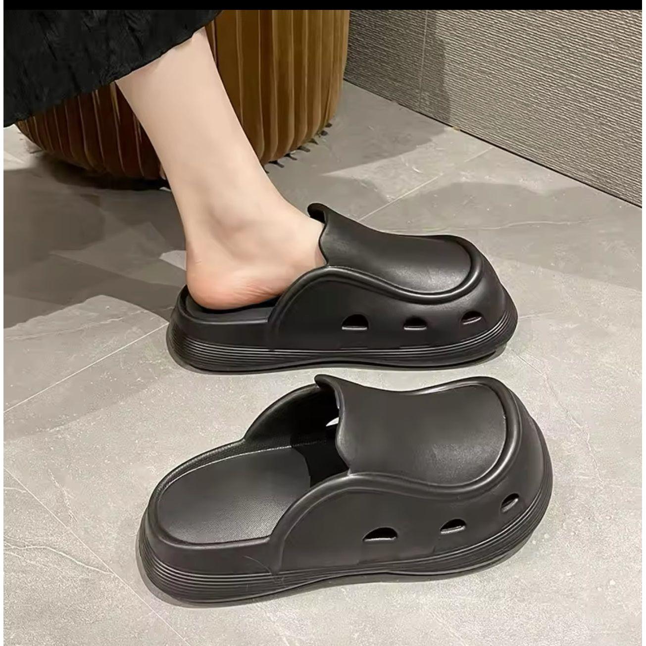 Thick bottom closed toe porous shoes.