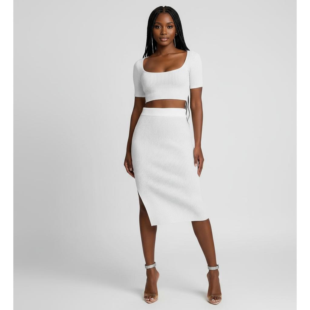 Woman wearing a white two-piece outfit on a gray background