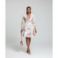 Woman wearing a floral dress with a plain background