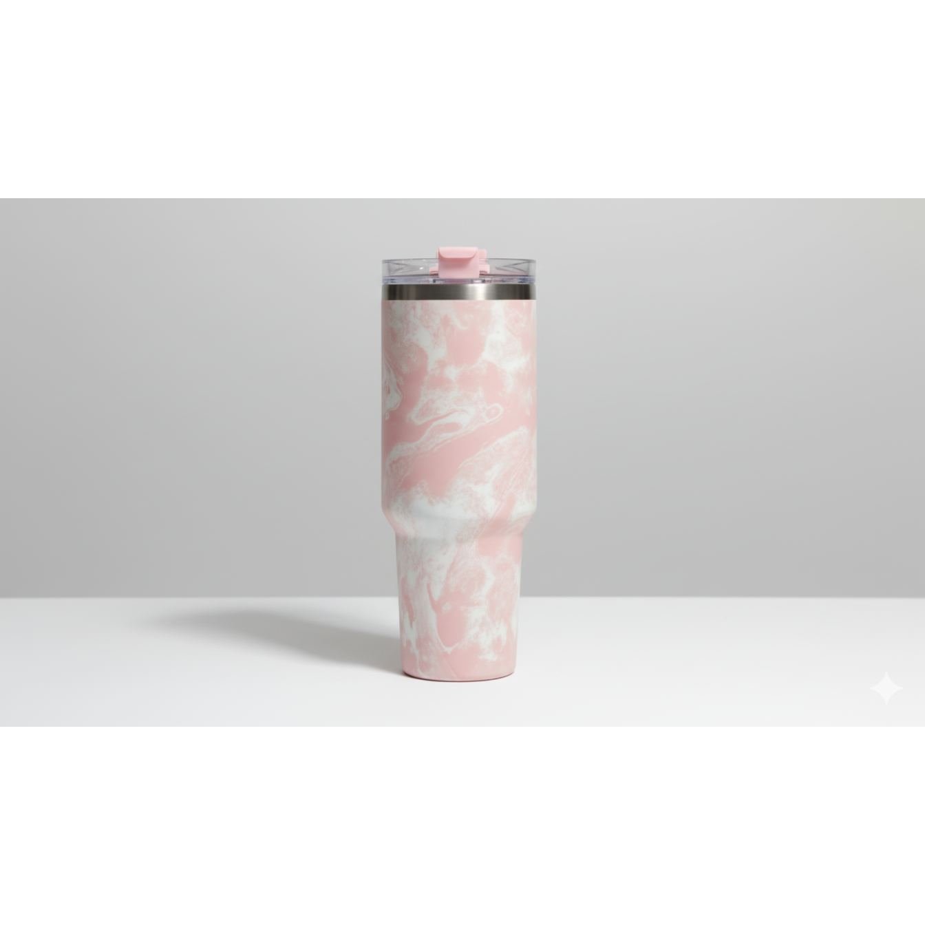 Pink and white marbled tumbler on a light gray background