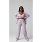Woman wearing a lavender outfit on a white background