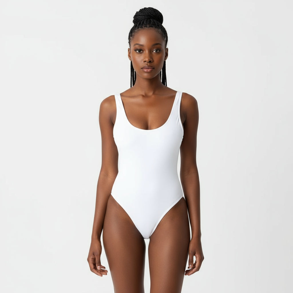 Woman in a white swimsuit on a beach