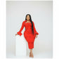 Woman wearing a red dress with bell sleeves against a white background