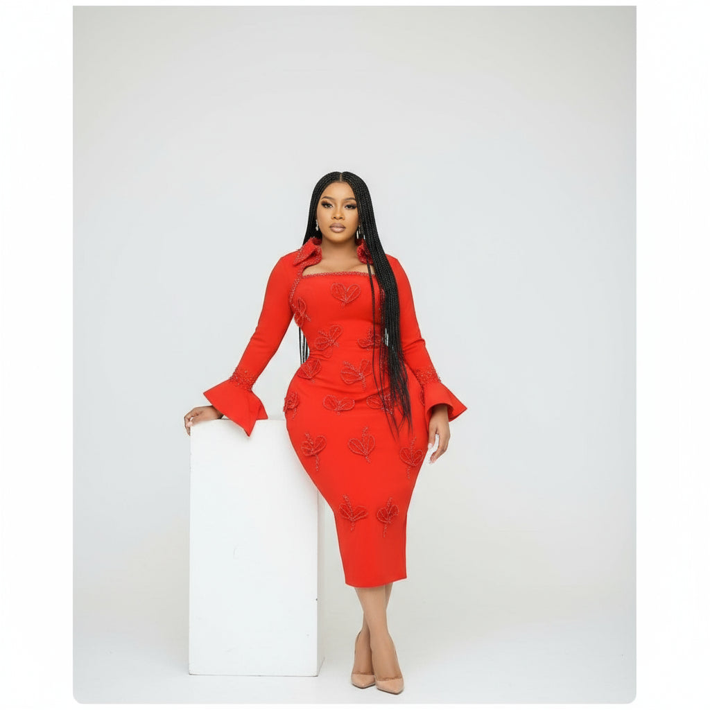 Woman wearing a red dress with bell sleeves against a white background