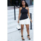 Sleeveless Pleated Mini Dress.