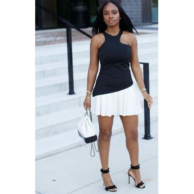 Sleeveless Pleated Mini Dress.