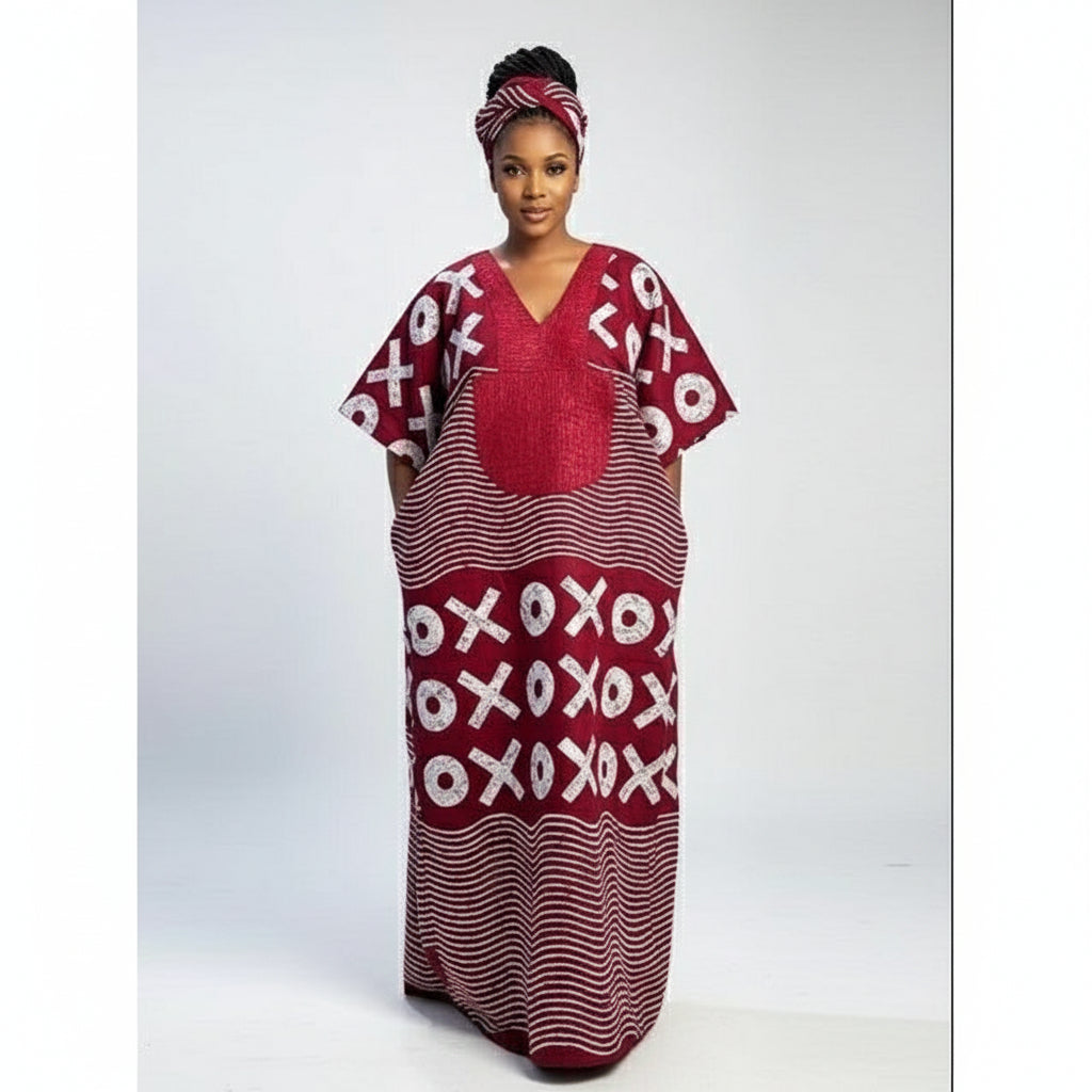 Woman wearing a red and white patterned dress in a room.