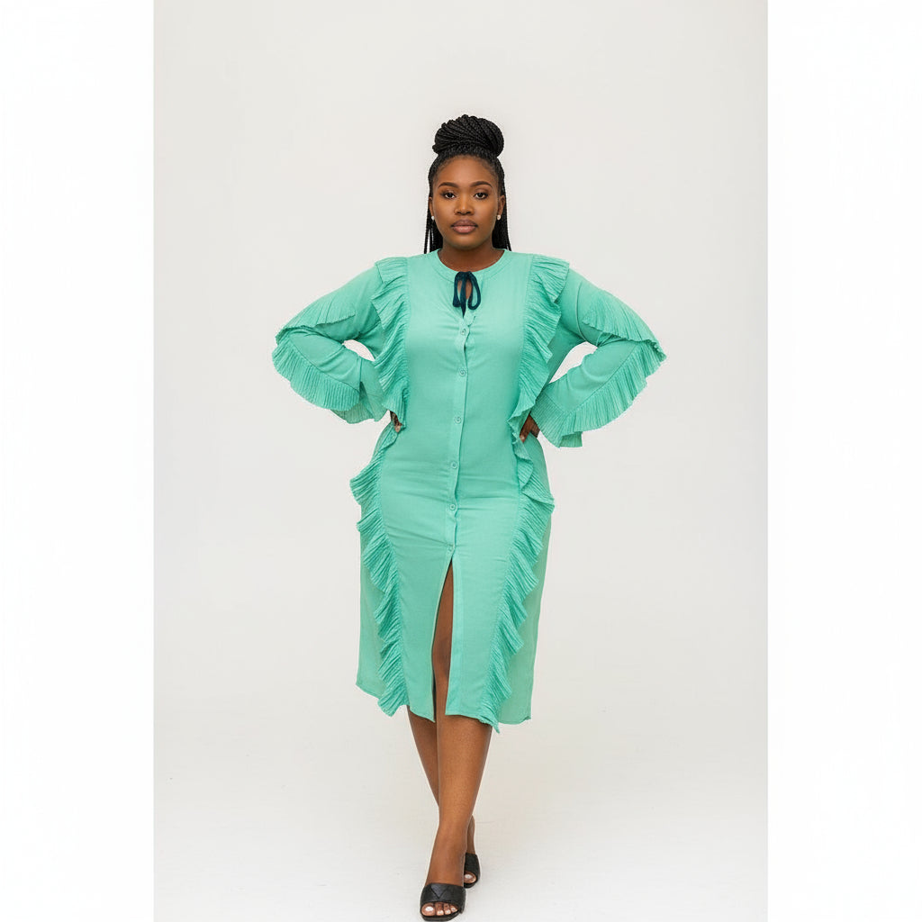 Woman in a light green dress standing in a restaurant.