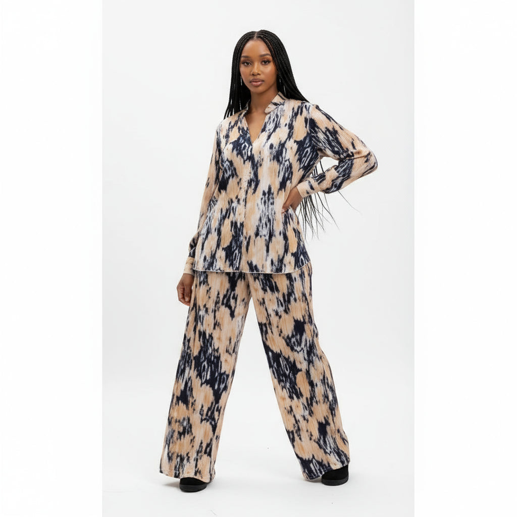 Woman wearing a patterned outfit on a white background