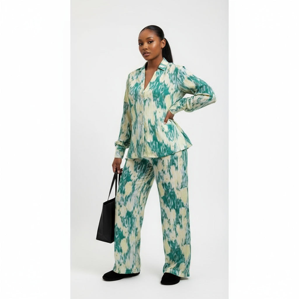 Woman wearing a green and white patterned outfit on a white background