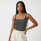 Black and white striped tank top worn by a person against a neutral background