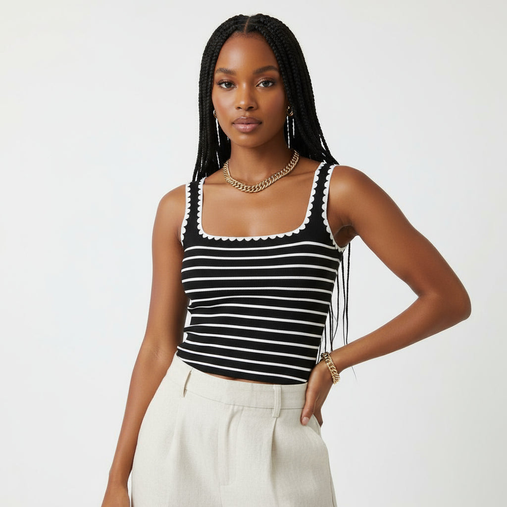 Black and white striped tank top worn by a person against a neutral background