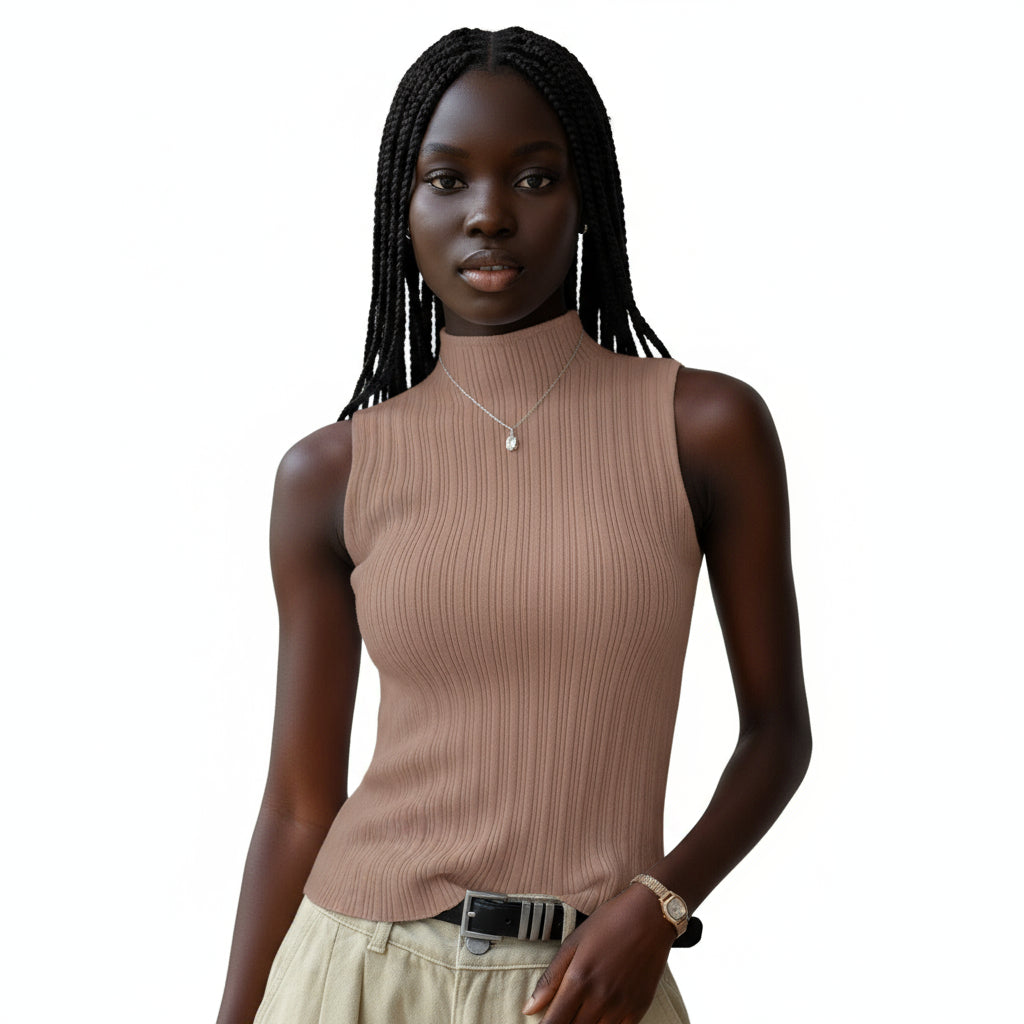 Person wearing a brown ribbed sleeveless top against a neutral background