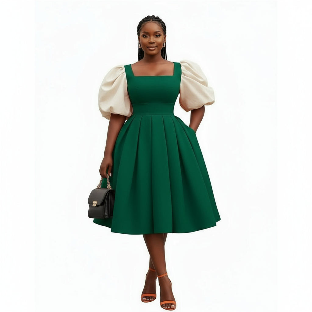 Woman wearing a green dress with white puff sleeves on a white background