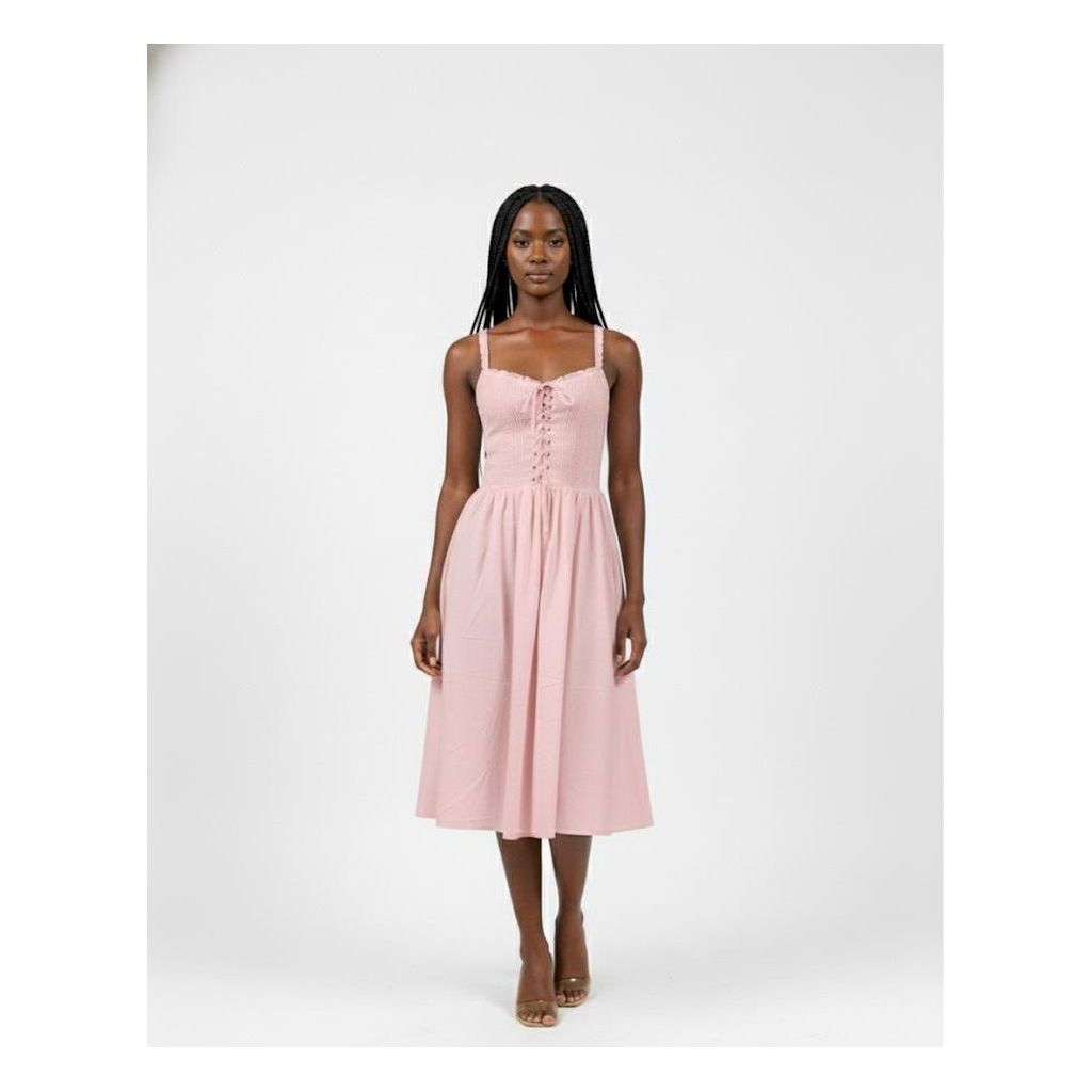 Woman wearing a pink dress on a white background