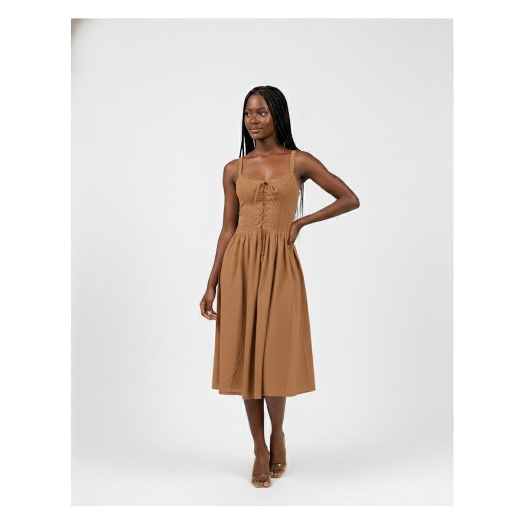 Woman wearing a brown dress on a white background