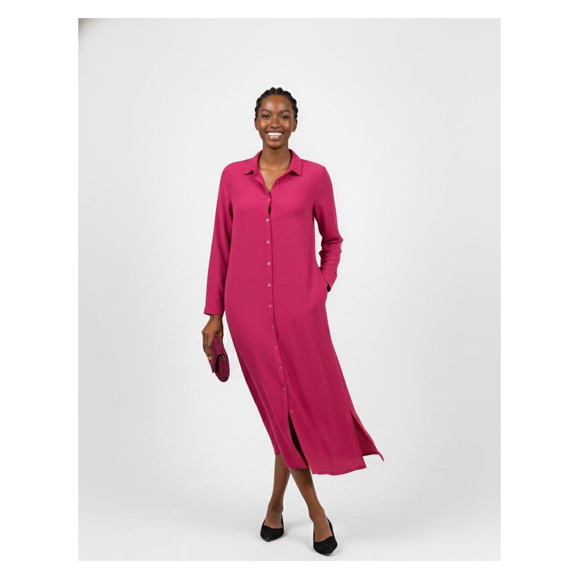 Woman wearing a pink dress on a white background