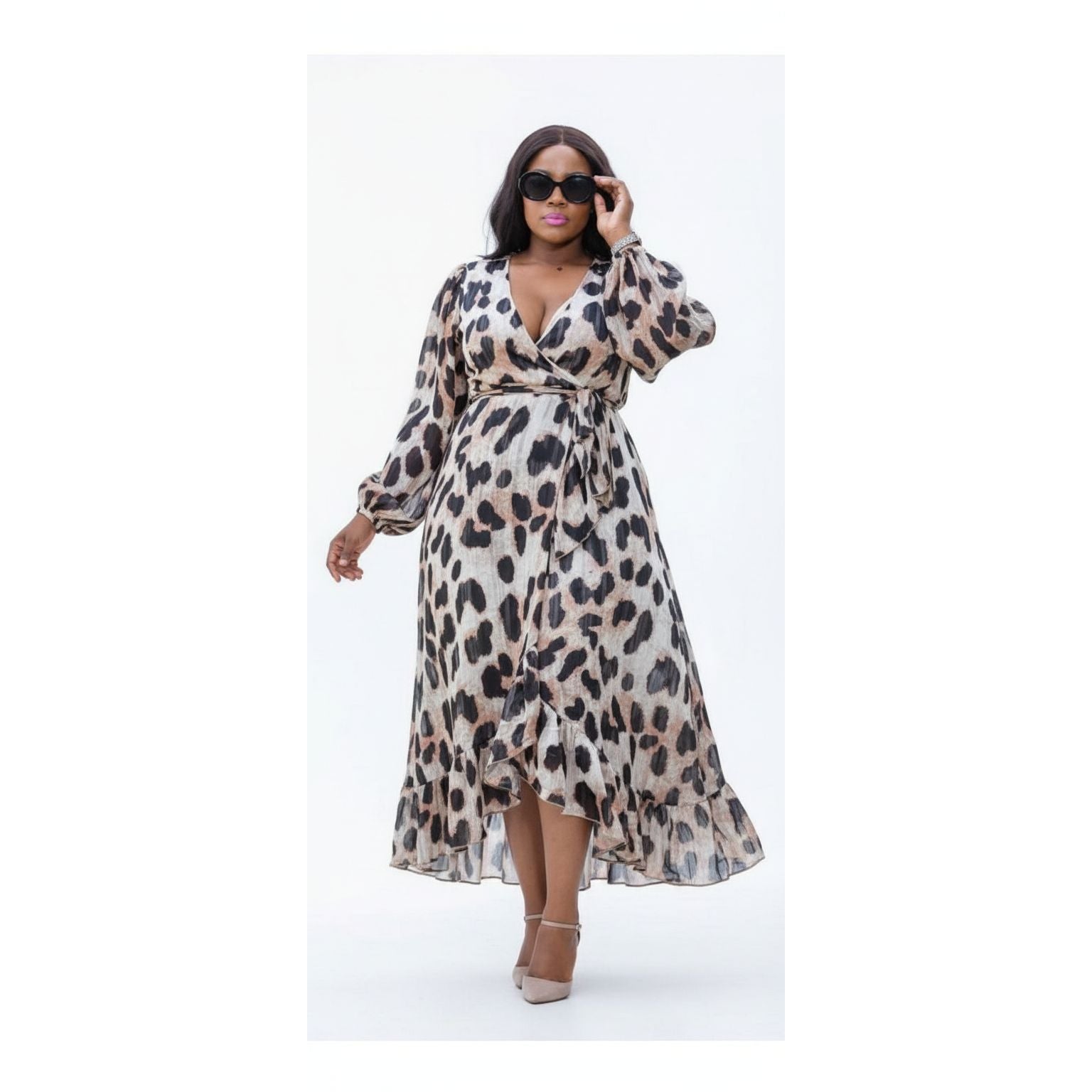 Woman wearing a leopard print dress on a white background