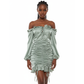 Green off-shoulder dress on a mannequin against a white background