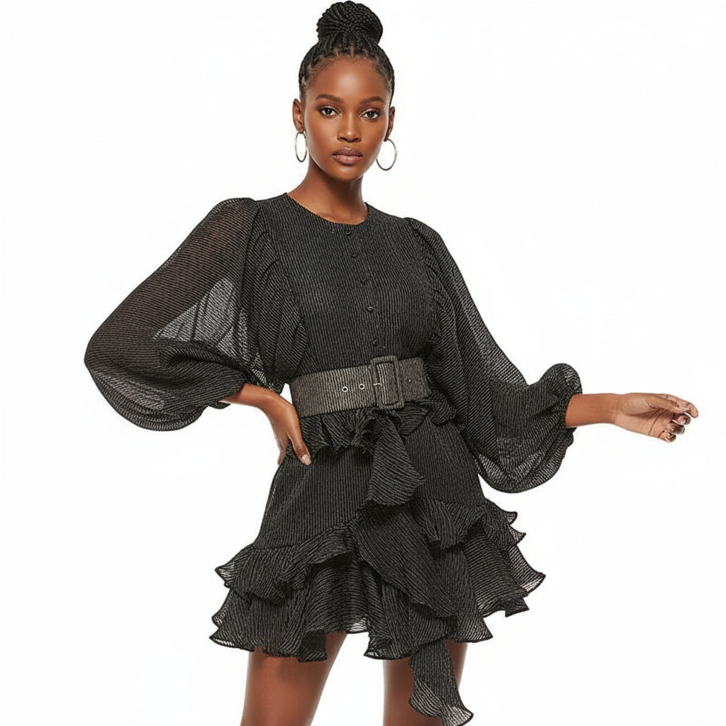 A model wearing a black long sleeve dress with ruffle details and a lantern sleeve design.