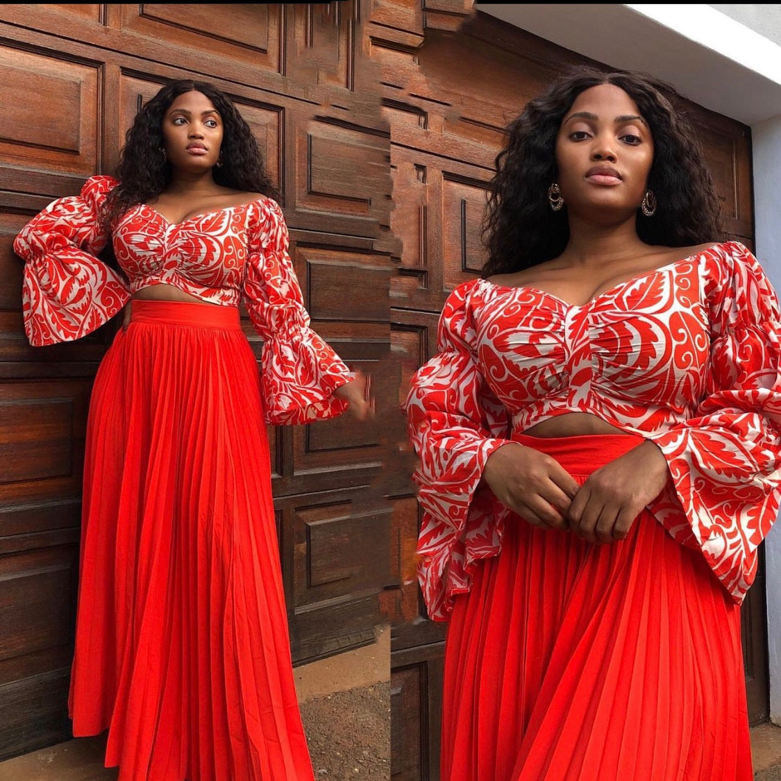 A model wearing a high waisted pleated skirt and a long sleeve top with a floral pattern, both in red.