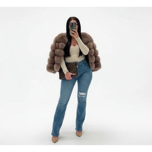 Person wearing a fur coat and jeans on a white background