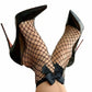 A pair of black mesh fishnet socks with a bow design at the ankle, worn with high-heeled shoes.