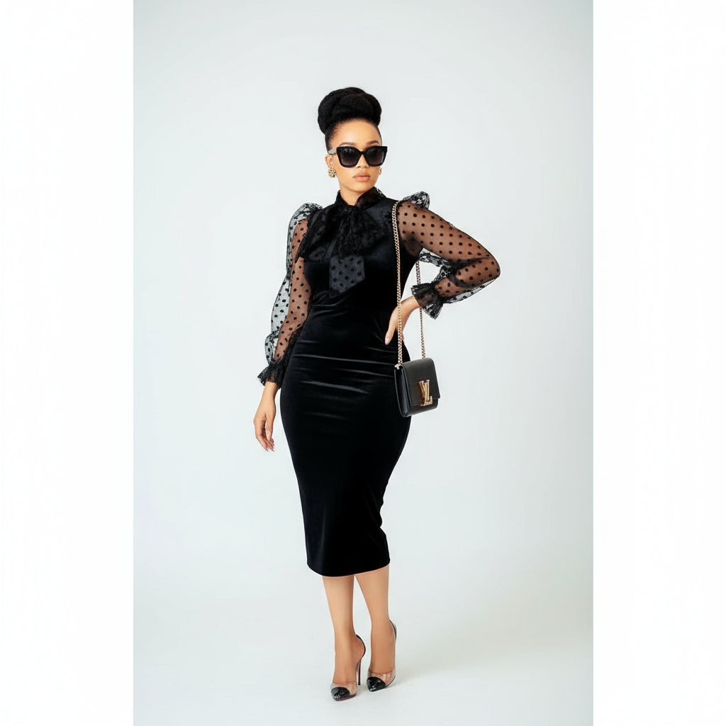 A woman wearing a black bodycon dress with 3/4 length sleeves, paired with sunglasses and a Louis Vuitton bag, standing in a public area.
