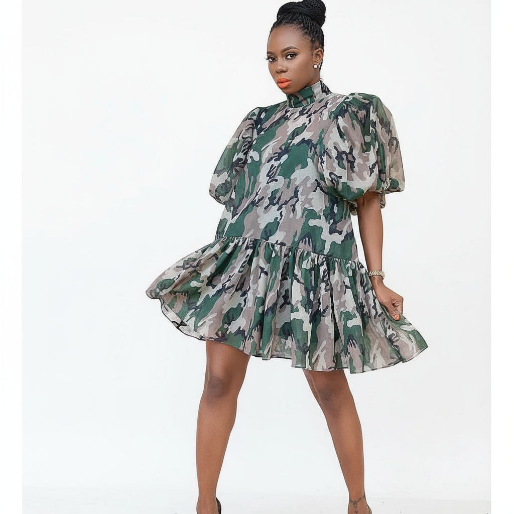 A woman wearing a camouflage design dress with puff sleeves and a round neckline.